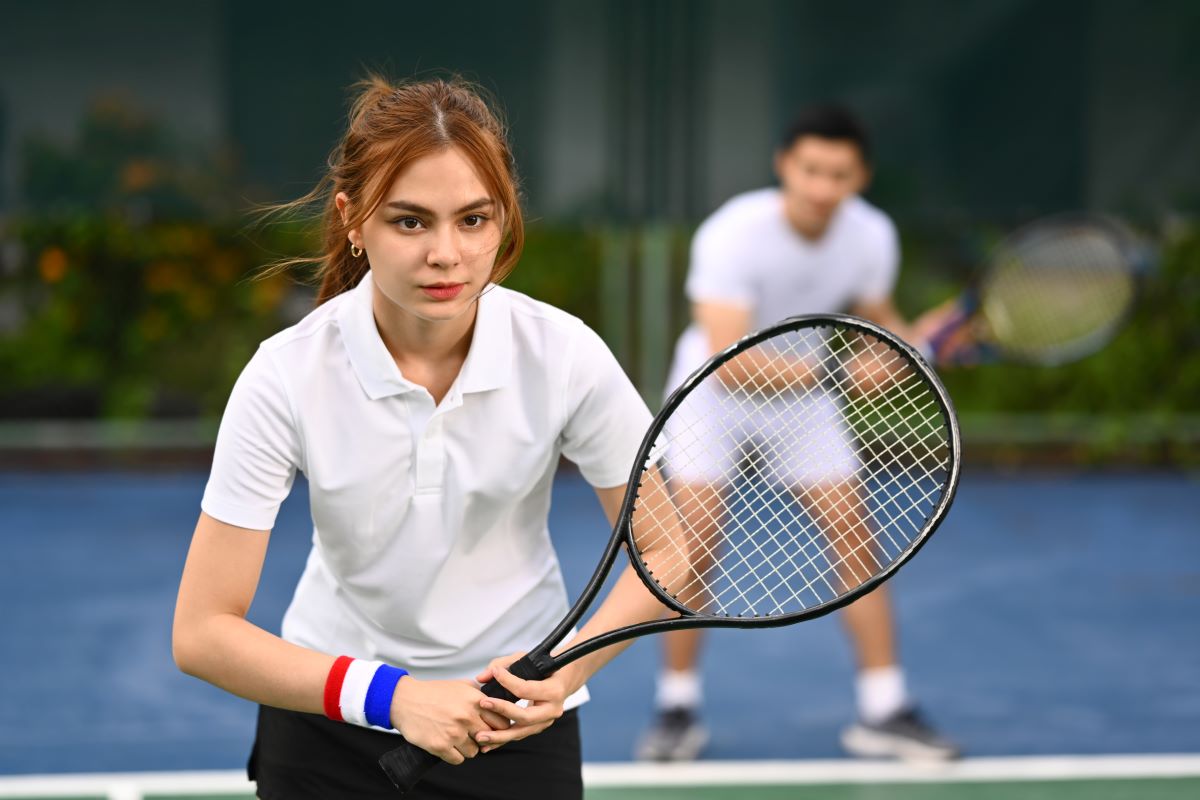 determined-female-tennis-player-with-racket-standi-2023-11-27-04-53-05-utc.jpg