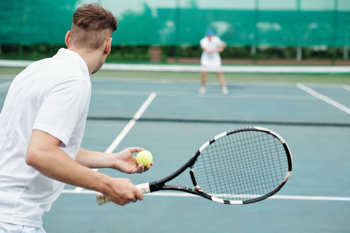 man-playing-tennis-with-friend-2023-11-27-05-31-50-utc.jpg